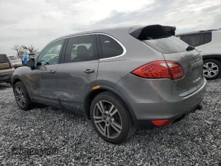 2011 Porsche Cayenne S with VIN WP1AB2A2XBLA55565, listed as a Copart auction lot 63094305 with 105,250 mi miles and Salvage title. Bid and sale history available at DreamBid. Image 2.