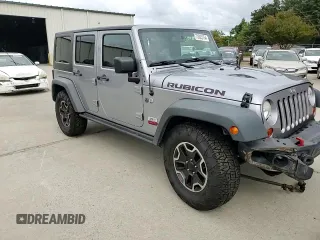 2013 Jeep Wrangler Unlimited Rubicon 10th Anniversary z VIN 1C4HJWFG3DL703331, wystawiony jako Copart lot #70823154 z przebiegiem 148 860 mil mil oraz Szkoda całkowita • Salvage title. Historia ofert i sprzedaży dostępna na DreamBid. Obrazek 11.