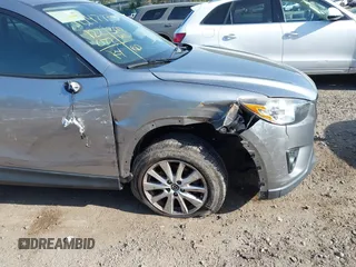 2014 Mazda CX-5 Touring with VIN JM3KE4CY0E0302583, listed as a IAAI auction lot 41947735 with 122,077 mi miles. Bid and sale history available at carsss.com. Image 6.