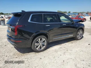 2024 Cadillac XT6 Premium Luxury z VIN 1GYKPERS1RZ755490, wystawiony jako Copart lot #49706575 z przebiegiem 4 239 mil mil oraz Szkoda całkowita • Salvage title. Historia ofert i sprzedaży dostępna na DreamBid. Obrazek 3.