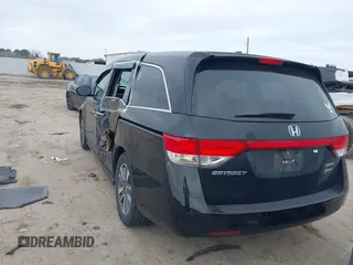 2014 Honda Odyssey Touring with VIN 5FNRL5H9XEB045695, listed as a IAAI auction lot 41545348 with 131,472 mi miles and . Bid and sale history available at carsss.com. Image 3.