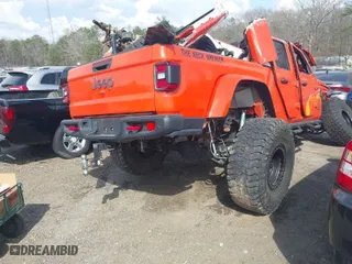 2020 Jeep Gladiator Rubicon with VIN 1C6JJTBG0LL164890, listed as a IAAI auction lot 41795545 with 77,860 mi miles. Bid and sale history available at carsss.com. Image 4.