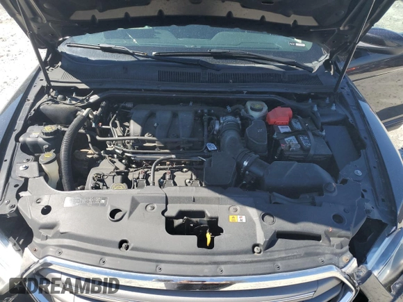 2014 Ford Taurus SEL z VIN 1FAHP2E82EG150298, wystawiony jako Copart lot #49546245 z przebiegiem 147 956 mil mil oraz Szkoda całkowita • Salvage title. Historia ofert i sprzedaży dostępna na DreamBid. Obrazek 13.