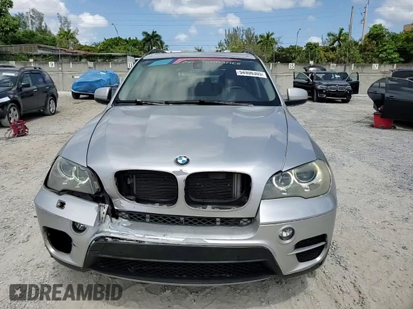 2013 BMW X5 xDrive35i z VIN 5UXZV4C5XD0B03182, wystawiony jako Copart lot #54906305 z przebiegiem 166 493 mil mil oraz Szkody całkowita. Historia ofert i sprzedaży dostępna na DreamBid. Obrazek 14.