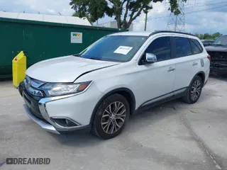 2016 Mitsubishi Outlander SE with VIN JA4AD3A34GZ021310, listed as a IAAI auction lot 40411249 with 118,599 mi miles. Bid and sale history available at carsss.com. Image 2.