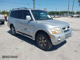 2003 Mitsubishi Montero LTD with VIN JA4NW51S53J030850, listed as a IAAI auction lot 42063733 with 210,810 mi miles. Bid and sale history available at carsss.com. Image 1.