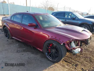 2022 Dodge Charger Scat Pack Widebody with VIN 2C3CDXGJ5NH189146, listed as a IAAI auction lot 41603805 with 30,212 mi miles and . Bid and sale history available at carsss.com. Image 1.