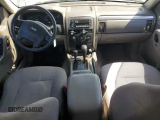 2003 Jeep Grand Cherokee Laredo with VIN 1J4GW48S23C524693, listed as a Copart auction lot 64461755 with 243,936 mi miles and Salvage title. Bid and sale history available at DreamBid. Image 8.