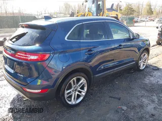 2015 Lincoln MKC with VIN 5LMTJ2AH2FUJ12531, listed as a IAAI auction lot 41639903 with 112,835 mi miles. Bid and sale history available at carsss.com. Image 4.