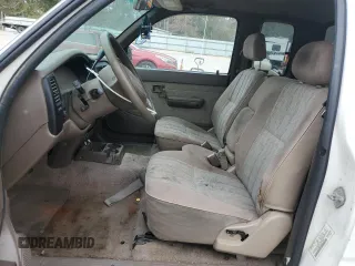 1999 Toyota Tacoma z VIN 4TAVL52N6XZ555376, wystawiony jako Copart lot #85763154 z przebiegiem 229 914 mil mil oraz Nie do naprawy • Non repairable. Historia ofert i sprzedaży dostępna na DreamBid. Obrazek 7.