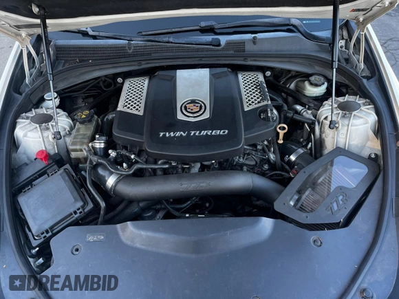 2014 Cadillac CTS Vsport Premium RWD z VIN 1G6AV5S87E0163180, wystawiony jako Copart lot #88171835 z przebiegiem 156 789 mil mil oraz Szkoda całkowita • Salvage title. Historia ofert i sprzedaży dostępna na DreamBid. Obrazek 7.