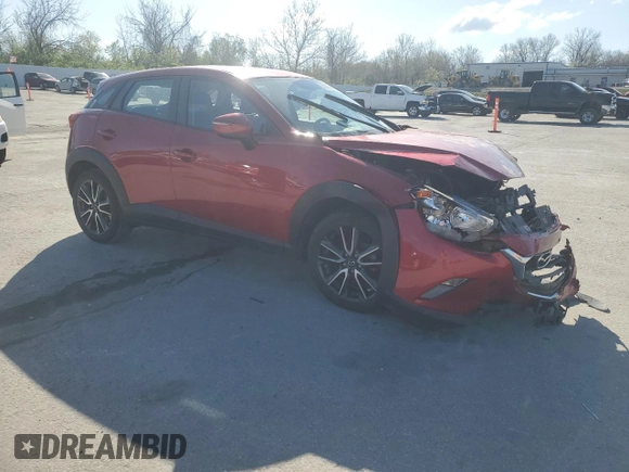 2017 Mazda CX-3 Touring z VIN JM1DKDC75H0170331, wystawiony jako Copart lot #51997455 z przebiegiem 141 405 mil mil oraz Szkoda całkowita • Salvage title. Historia ofert i sprzedaży dostępna na DreamBid. Obrazek 4.