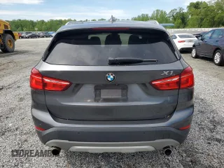 2016 BMW X1 xDrive28i z VIN WBXHT3C37GP888364, wystawiony jako Copart lot #53644975 z przebiegiem 119 725 mil mil oraz Szkoda całkowita • Salvage title. Historia ofert i sprzedaży dostępna na DreamBid. Obrazek 6.