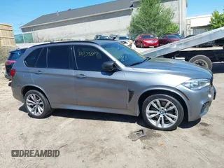2014 BMW X5 xDrive50i with VIN 5UXKR6C57E0J72301, listed as a IAAI auction lot 39379887 with 117,012 mi miles. Bid and sale history available at carsss.com. Image 13.