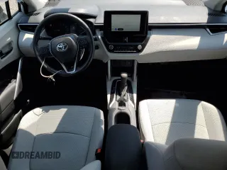 2023 Toyota Corolla Cross LE with VIN 7MUCAABG3PV060880, listed as a Copart auction lot 59664915 with 18,246 mi miles and Salvage title. Bid and sale history available at DreamBid. Image 8.