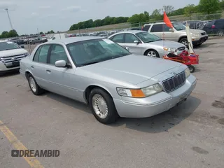 1999 Mercury Grand Marquis LS z VIN 2MEFM75W7XX659031, wystawiony jako IAAI lot #42362387 z przebiegiem 140 067 mil mil oraz . Historia ofert i sprzedaży dostępna na DreamBid. Obrazek 1.