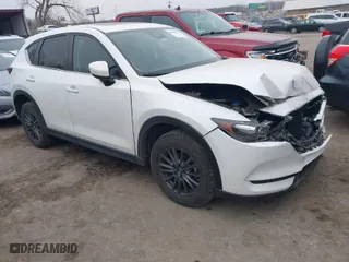2021 Mazda CX-5 Touring with VIN JM3KFACM0M0412718, listed as a IAAI auction lot 41486753 with NaN miles. Bid and sale history available at carsss.com. Image 1.