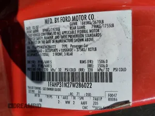 2007 Ford Focus S with VIN 1FAHP31N27W286022, listed as a Copart auction lot 56997445 with 112,157 mi miles and Salvage title. Bid and sale history available at DreamBid. Image 12.