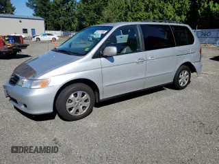 2003 Honda Odyssey EX-L with VIN 5FNRL18943B136841, listed as a Copart auction lot 63111185 with 189,039 mi miles and Salvage title. Bid and sale history available at DreamBid. Image 1.