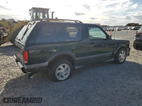 1993 GMC Jimmy z VIN 1GDCT18Z9P0810178, wystawiony jako Copart lot #79442614 z przebiegiem 19 514 mil mil oraz Szkoda całkowita • Salvage title. Historia ofert i sprzedaży dostępna na DreamBid. Obrazek 3.