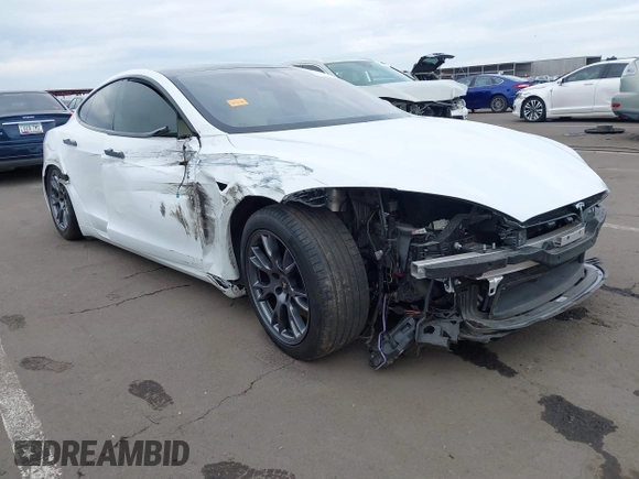 2021 Tesla Model S Long Range with VIN 5YJSA1E57MF453815, listed as a IAAI auction lot 41818700 with 51,176 mi miles and . Bid and sale history available at DreamBid. Image 1.