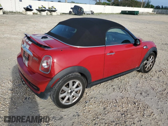 2013 MINI Roadster S z VIN WMWSY3C56DT593875, wystawiony jako Copart lot #74982124 z przebiegiem 64 622 mil mil oraz Szkody całkowita. Historia ofert i sprzedaży dostępna na DreamBid. Obrazek 3.