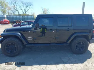 2010 Jeep Wrangler Unlimited Sahara with VIN 1J4HA5H17AL140941, listed as a IAAI auction lot 42004203 with 126,100 mi miles. Bid and sale history available at carsss.com. Image 13.