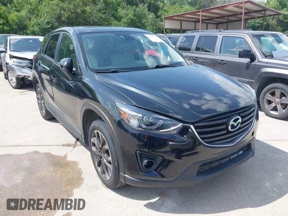 2016 Mazda CX-5 Grand Touring z VIN JM3KE2DY2G0765444, wystawiony jako IAAI lot #42527577 z przebiegiem 162 871 mil mil oraz . Historia ofert i sprzedaży dostępna na DreamBid. Obrazek 1.