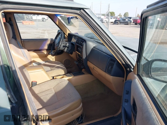1997 Jeep Cherokee Country with VIN 1J4FT78S1VL522295, listed as a IAAI auction lot 42481630 with 340,239 mi miles and . Bid and sale history available at DreamBid. Image 5.