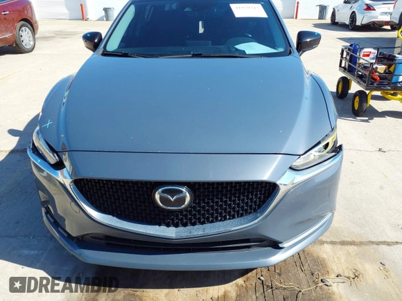 2021 Mazda 6 Carbon Edition with VIN JM1GL1WY4M1619533, listed as a IAAI auction lot 41979213 with 84,783 mi miles and . Bid and sale history available at DreamBid. Image 12.