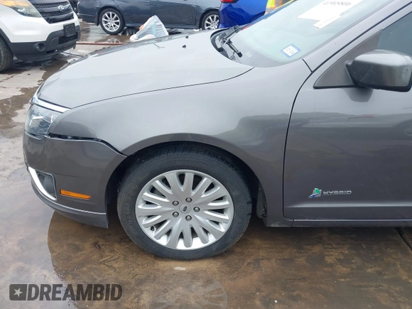 2012 Ford Fusion Hybrid z VIN 3FADP0L33CR289548, wystawiony jako IAAI lot #41905806 z przebiegiem 121 233 mil mil oraz . Historia ofert i sprzedaży dostępna na DreamBid. Obrazek 19.