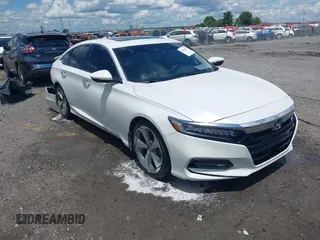 2018 Honda Accord Touring z VIN 1HGCV2F92JA006718, wystawiony jako IAAI lot #42201457 z przebiegiem 129 137 mil mil oraz . Historia ofert i sprzedaży dostępna na DreamBid. Obrazek 1.