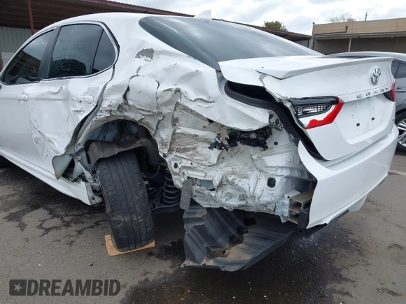 2023 Toyota Camry SE with VIN 4T1G11AK2PU822122, listed as a IAAI auction lot 41880757 with 56,106 mi miles and . Bid and sale history available at DreamBid. Image 6.