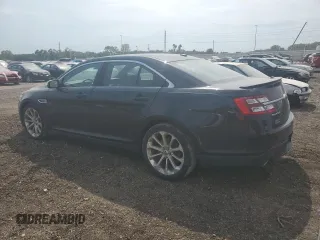 2013 Ford Taurus Limited with VIN 1FAHP2J87DG181051, listed as a Copart auction lot 70630404 with 157,323 mi miles and Salvage title. Bid and sale history available at DreamBid. Image 2.