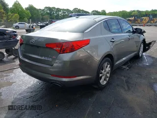2013 Kia Optima EX z VIN 5XXGN4A71DG130926, wystawiony jako IAAI lot #42080433 z przebiegiem 197 900 mil mil oraz . Historia ofert i sprzedaży dostępna na DreamBid. Obrazek 4.