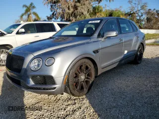 2019 Bentley Bentayga V8 z VIN SJAAM2ZV4KC024727, wystawiony jako Copart lot #74625214 z przebiegiem Nie podano mil oraz Nie do naprawy • Non repairable. Historia ofert i sprzedaży dostępna na DreamBid. Obrazek 1.