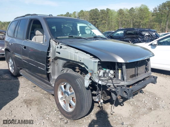 2005 GMC Envoy SLE with VIN 1GKDS13S452306939, listed as a IAAI auction lot 41931667 with 236,955 mi miles. Bid and sale history available at carsss.com. Image 1.