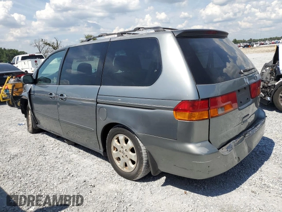 2002 Honda Odyssey EX-L with VIN 2HKRL18962H552809, listed as a Copart auction lot 63631115 with 224,019 mi miles and Salvage title. Bid and sale history available at DreamBid. Image 2.