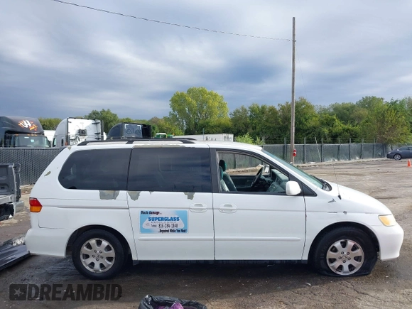 2004 Honda Odyssey EX-L with VIN 5FNRL18074B109717, listed as a IAAI auction lot 37731273 with 314,449 mi miles and . Bid and sale history available at DreamBid. Image 13.