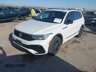 2024 Volkswagen Tiguan SE R-Line Black with VIN 3VVCB7AX0RM099863, listed as a IAAI auction lot 41851884 with 14,091 mi miles and . Bid and sale history available at DreamBid. Image 2.