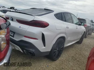 2025 BMW X6 M60i with VIN 5UX43EX07S9X98716, listed as a Copart auction lot 73753074 with 63 mi miles and Salvage Title. Bid and sale history available at carsss.com. Image 3.
