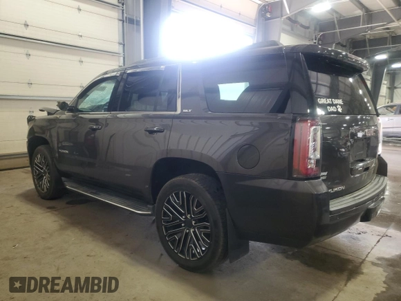 2015 GMC Yukon SLT with VIN 1GKS2BKC7FR279302, listed as a Copart auction lot 47827085 with 176,076 mi miles and Salvage Title. Bid and sale history available at carsss.com. Image 2.