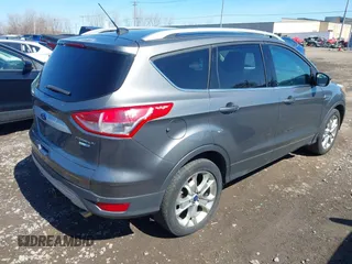 2014 Ford Escape Titanium with VIN 1FMCU9JX1EUB94776, listed as a IAAI auction lot 42063678 with 138,036 mi miles. Bid and sale history available at carsss.com. Image 4.