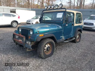 1995 Jeep Wrangler S with VIN 1J4FY19P5SP243137, listed as a IAAI auction lot 41787400 with 136,565 mi miles. Bid and sale history available at carsss.com. Image 2.