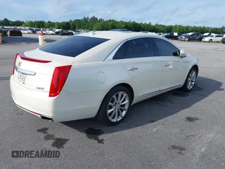 2013 Cadillac XTS Premium z VIN 2G61S5S35D9103948, wystawiony jako IAAI lot #42090444 z przebiegiem 154 728 mil mil oraz . Historia ofert i sprzedaży dostępna na DreamBid. Obrazek 4.