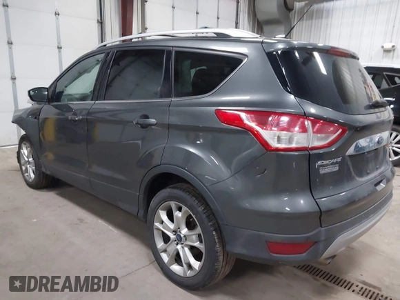 2016 Ford Escape Titanium with VIN 1FMCU9J90GUB35593, listed as a IAAI auction lot 42309020 with 173,019 mi miles and . Bid and sale history available at DreamBid. Image 3.