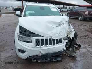 2014 Jeep Grand Cherokee Overland with VIN 1C4RJFCG9EC162098, listed as a IAAI auction lot 41746022 with 120,588 mi miles and . Bid and sale history available at DreamBid. Image 6.