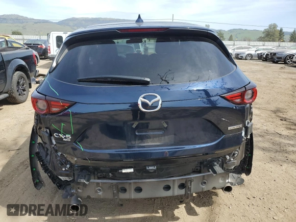 2021 Mazda CX-5 Grand Touring with VIN JM3KFBDM2M0494679, listed as a Copart auction lot 50017675 with 25,965 mi miles and Salvage Title. Bid and sale history available at carsss.com. Image 6.