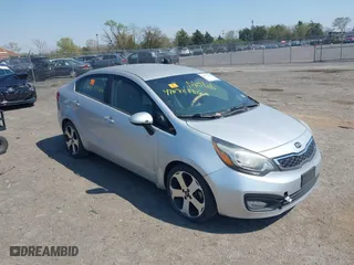 2014 Kia Rio EX with VIN KNADN4A34E6352924, listed as a IAAI auction lot 42072886 with 1 mi miles. Bid and sale history available at carsss.com. Image 1.
