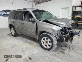 2005 GMC Envoy SLE с VIN 1GKDS13S752274178, выставлен на аукционе Copart как лот 55289005 с пробегом 199 378 миль миль и Списание • Salvage title. История ставок и продаж доступна на DreamBid. Изображение 4.